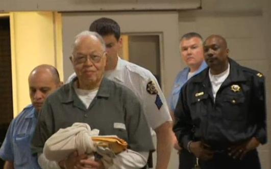 Kermit Gosnell doing the perp-walk.