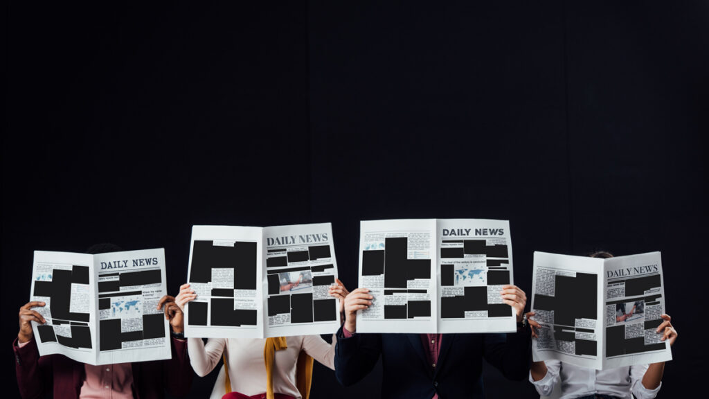 Photo of censored newspapers.
